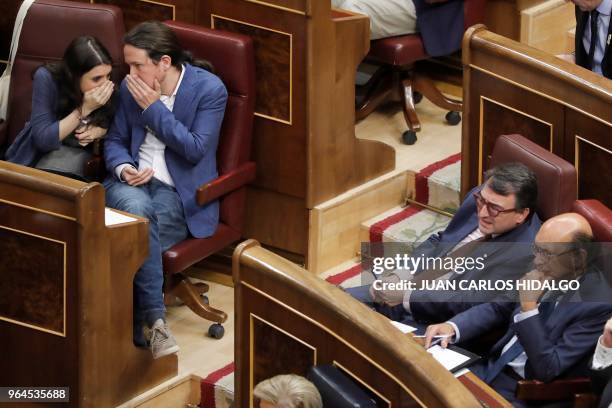 Podemos party MPs, Pablo Iglesias and Irene Montero talk next to Basque Nationalist Party spokesman, Aitor Esteban and PNV MP Mikel Legarda during a...