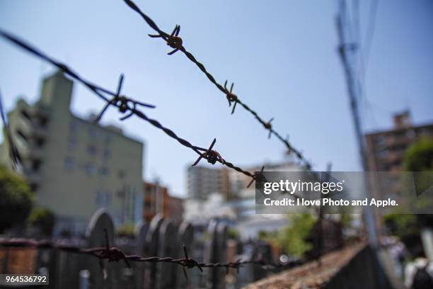 barbed wire - toshima ward stock pictures, royalty-free photos & images