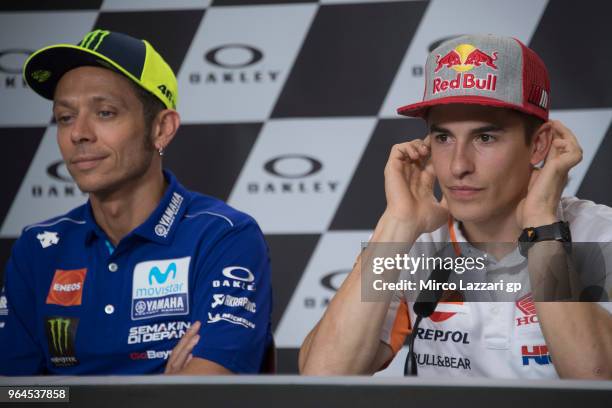 Marc Marquez of Spain and Repsol Honda Team and Valentino Rossi of Italy and Movistar Yamaha MotoGP look on during the press conference pre-event...