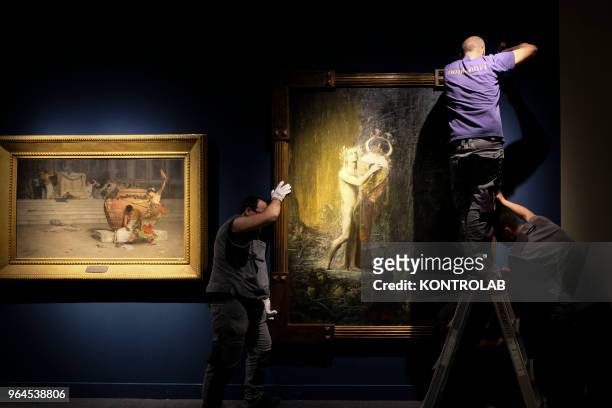 Specialists work to set up the exhibition 'L'Immagine Invisibile" at Archeological Museum in Paestum southern Italy. The exhibition shows paintings,...