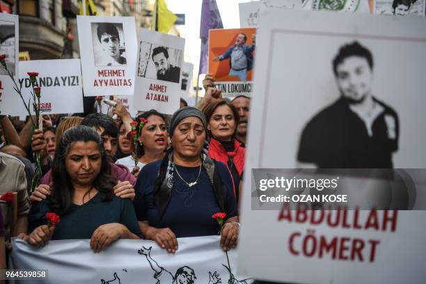 People demonstrate, shouting slogans and holding pictures of Gezi Park victims, on May 31, 2018 in Istanbul, to mark the fifth anniversary of the...