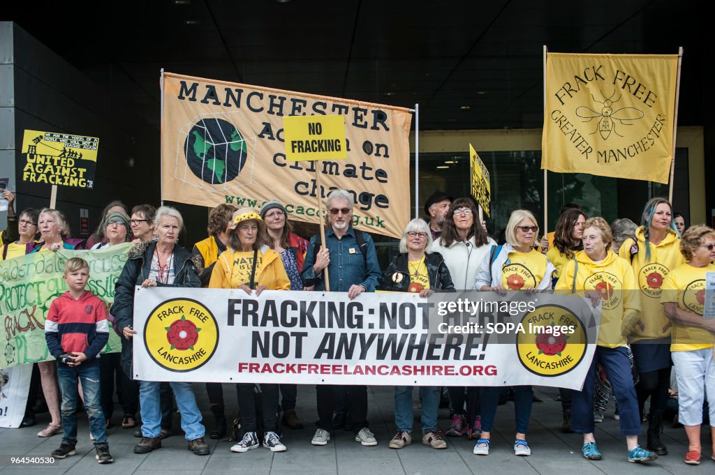 Protesters seen holding banners and placards during the...
