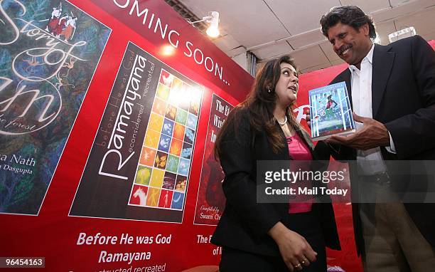 Kapil Dev launching sports journalist Tina Sharma Tiwari's debut novel, Running on Full, at the ongoing World Book Fair in New Delhi on February 4,...