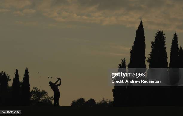 Tommy Fleetwood of England plays his second shot on thw 18th hole during Day One of the Italian Open at Gardagolf Country Club on May 31, 2018 in...
