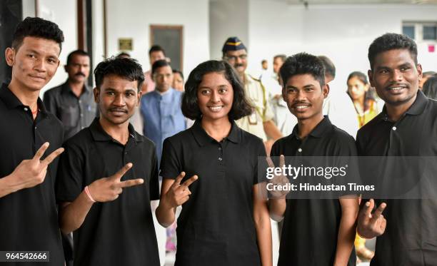 Umakant Madavi, Parmesh Aale, Manisha Dhurve, Vikas Soyam and Kavidas Katmode tribal ashram school students who conquered Mount Everest poses for...