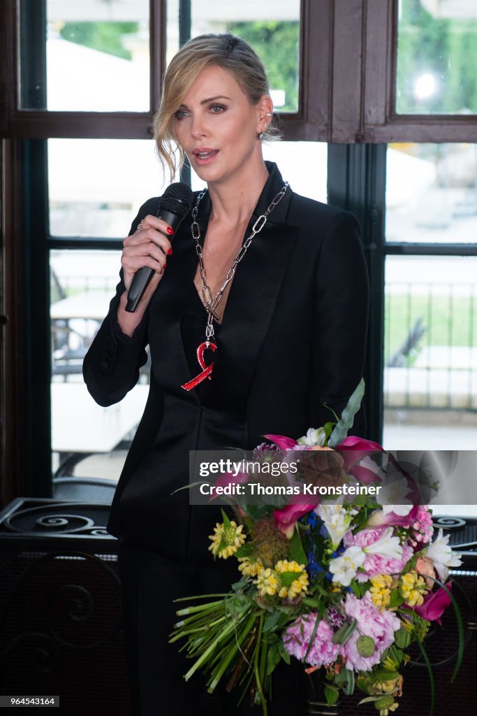 Charlize Theron Receives Swarovski Crystal Of Hope Award In Vienna