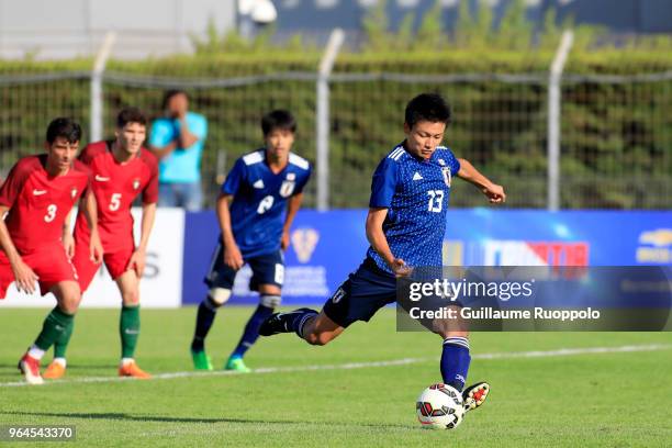 Ayase Ueda of Japan scores from the penalty sport during U20 match between Portugal and Japan of the International Football Festival tournament of...