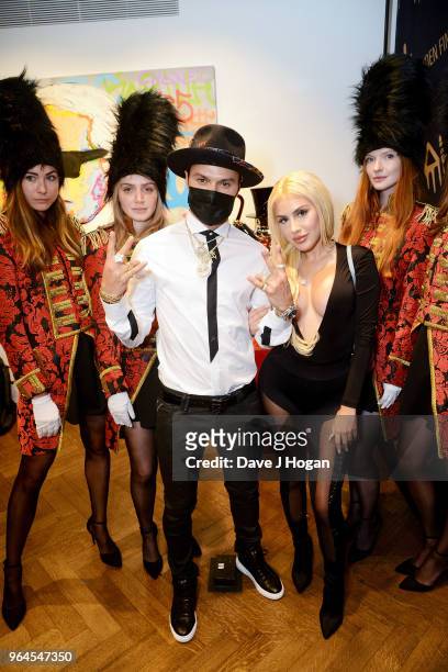 Artist Alec Monopoly and guest attend Alec Monopoly's, 'Breaking the Bank on Bond Street' exhibition launch party at the Eden Fine Art Gallery on May...