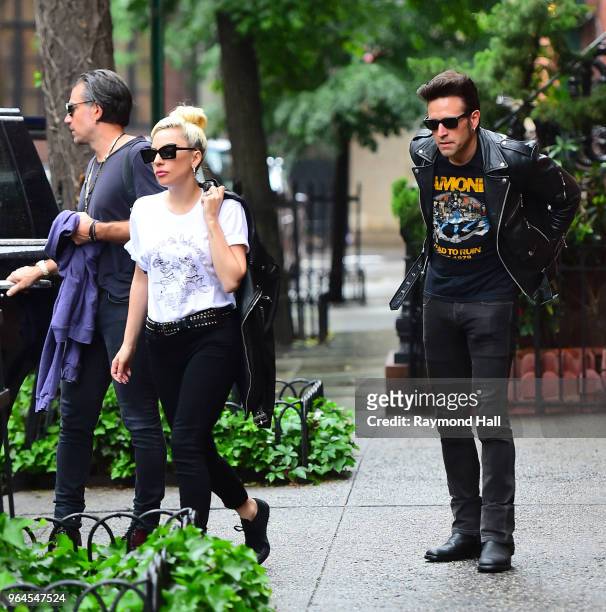 Singer Lady Gaga and Christian Carino are seen walking in Soho on May 31, 2018 in New York City.