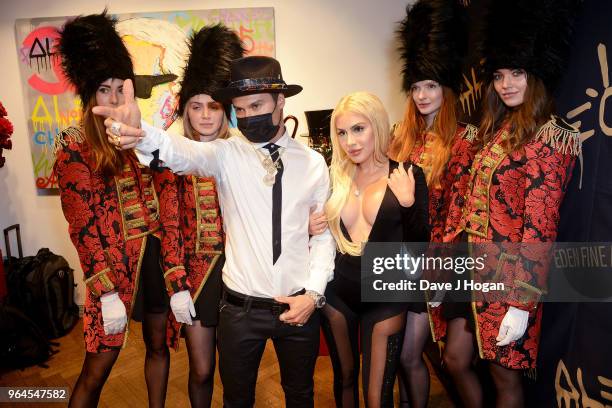 Artist Alec Monopoly and guest attend Alec Monopoly's, 'Breaking the Bank on Bond Street' exhibition launch party at the Eden Fine Art Gallery on May...