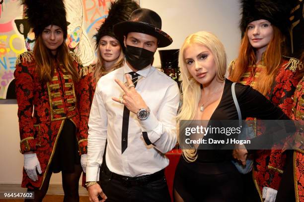 Artist Alec Monopoly and guest attend Alec Monopoly's, 'Breaking the Bank on Bond Street' exhibition launch party at the Eden Fine Art Gallery on May...