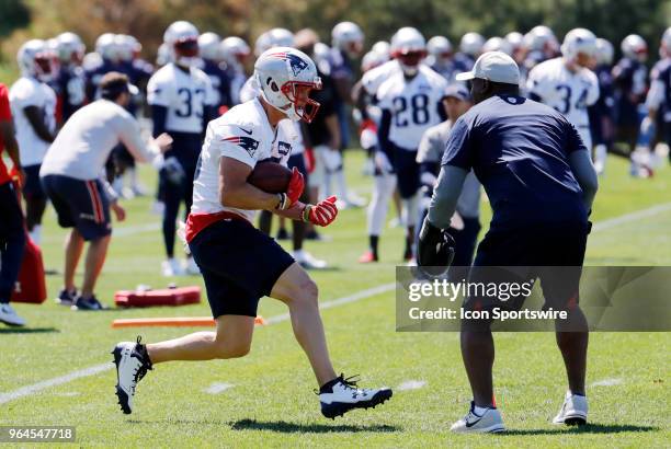 New England Patriots wide receiver Chris Hogan runs into the gauntlet during New England Patriots OTA on May 31 at the Patriots Practice Facility in...