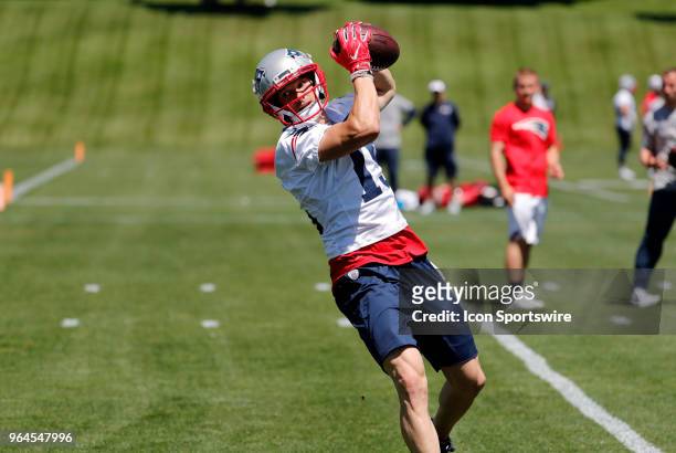 New England Patriots wide receiver Chris Hogan hauls in a pass during New England Patriots OTA on May 31 at the Patriots Practice Facility in...