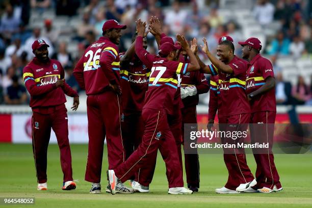 West Indies celebrate after dismissing Tamim Iqbal of the ICC World XI during the T20 match between ICC World XI and West Indies at Lord's Cricket...