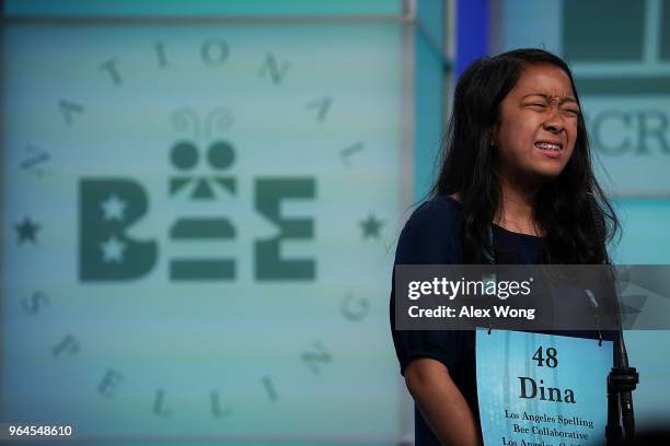 Medina Miranda of Los Angeles, California, reacts after she misspelled her word during round seven of the 91st Scripps National Spelling Bee at the...