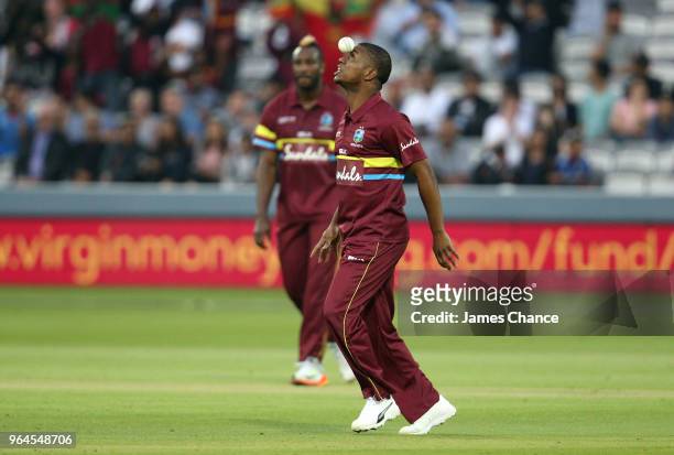 Evin Lewis of West Indies celebrates catching Dinesh Karthik of the ICC World XI out during the Hurricane Relief T20 match between the ICC World XI...