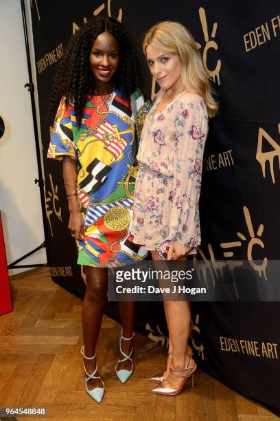 Sarah Mulindwa and Olivia Cox attend Alec Monopoly's, 'Breaking the Bank on Bond Street' exhibition launch party at the Eden Fine Art Gallery on May...
