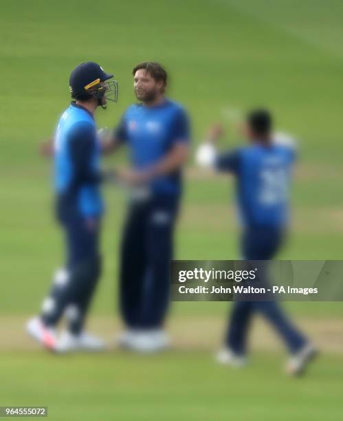 Rest of the World XI's Shahid Afridi celebrates taking the wicket of West Indies' Andre Fletcher during the special fundraising T20 International...