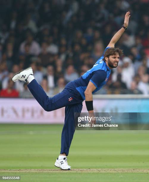 Shahid Afridi of the ICC World XI bowls during the Hurricane Relief T20 match between the ICC World XI and West Indies at Lord's Cricket Ground on...