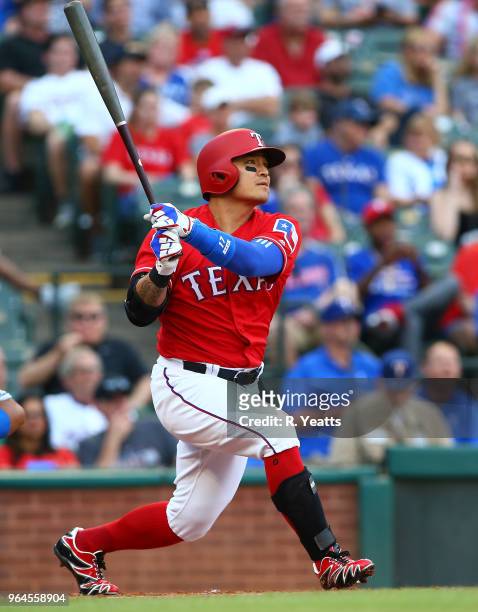 Shin-Soo Choo of the Texas Rangers hits in the first inning against the Kansas City Royals at Globe Life Park in Arlington on May 25, 2018 in...