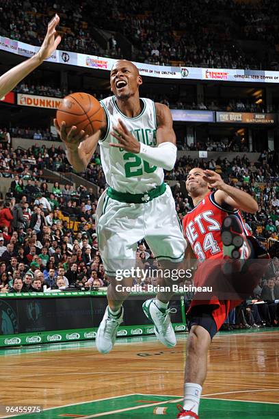 Ray Allen of the Boston Celtics drives the lane against Devin Harris of the New Jersey Nets on February 5, 2010 at the TD Garden in Boston,...