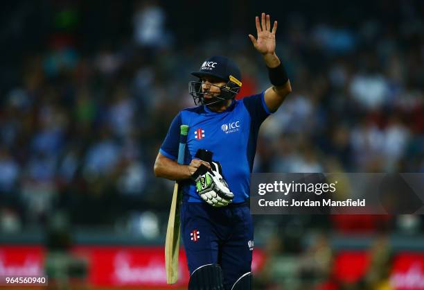 Shahid Afridi of ICC World XI waves to the crowd as he leaves the field during the T20 match between ICC World XI and West Indies at Lord's Cricket...