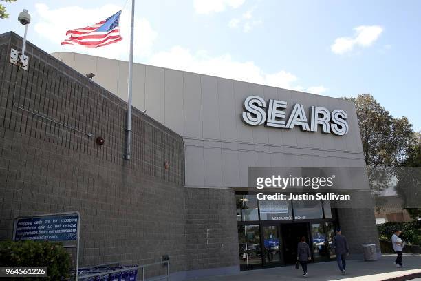 Customers enter a Sears store on May 31, 2018 in Richmond, California. Sears Holdings Corp. Annouced plans to close 72 unprofitable stores after 26...