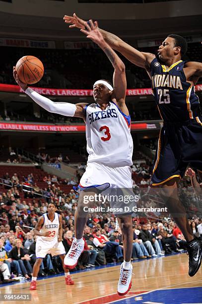 Allen Iverson of the Philadelphia 76ers shoots a layup against Brandon Rush of the Indiana Pacers during the game at Wachovia Center on January 25,...