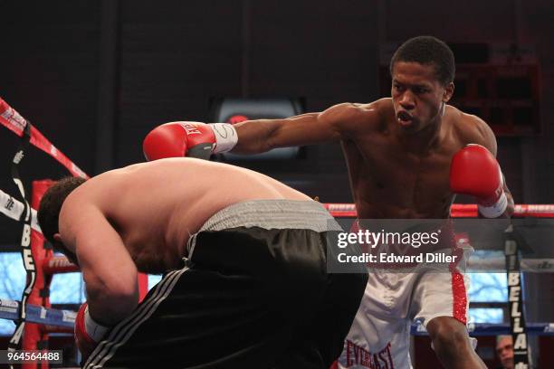 Patrick Day lands a left hand against Colby Courter at the Aviator Sports Complex on April 10, 2015 in the Brooklyn borough of New York City. Day...