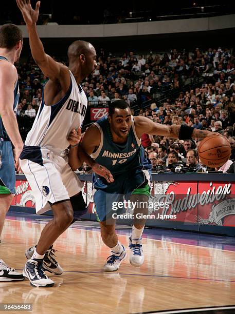 Wayne Ellington of the Minnesota Timberwolves drives against Quinton Ross of the Dallas Mavericks during a game at the American Airlines Center on...