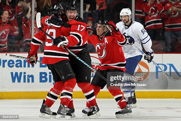 Travis Zajac of the New Jersey Devils celebrates his game tying goal in the third period against the Toronto Maple Leafs with teammtes Ilya Kovalchuk...