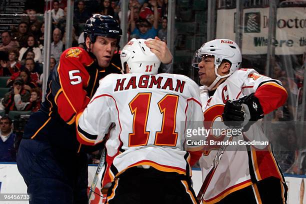 Bryan Allen of the Florida Panthers fights Niklas Hagman of the Calgary Flames and teammate Jarome Iginla at the BankAtlantic Center on February 5,...