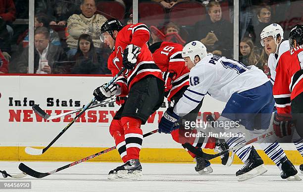 Ilya Kovalchuk of the New Jersey Devils skates against Wayne Primeau of the Toronto Maple Leafs at the Prudential Center on February 5, 2010 in...