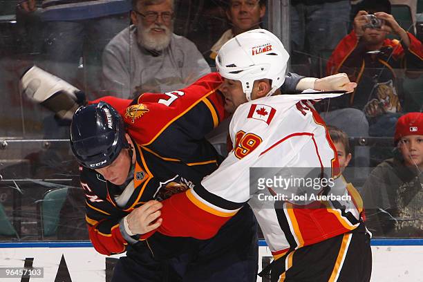 Bryan Allen of the Florida Panthers and Jamal Mayers of the Calgary Flames fight during the second period on February 5, 2010 at the BankAtlantic...