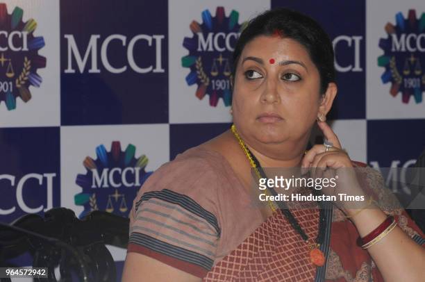 Union Textile Minister Smriti Irani looks on during an interactive session with Merchants' Chamber of Commerce and Industry at Grand Hotel on May 31,...