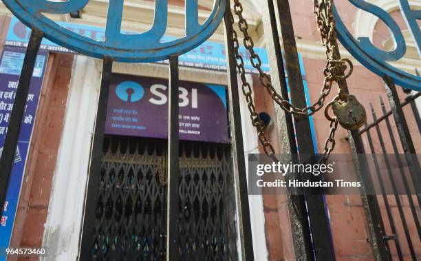 Branch of the State Bank of India , the country's biggest bank, is locked and closed for business, as over a million employees of India's state-owned...