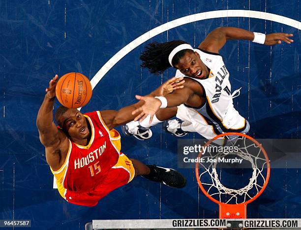 DeMarre Carroll of the Memphis Grizzlies battles for the rebound with Joey Dorsey of the Houston Rockets on February 5, 2010 at FedExForum in...