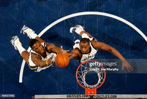 Hasheem Thabeet and Sam Young of the Memphis Grizzlies rebound against the Houston Rockets on February 5, 2010 at FedExForum in Memphis, Tennessee....