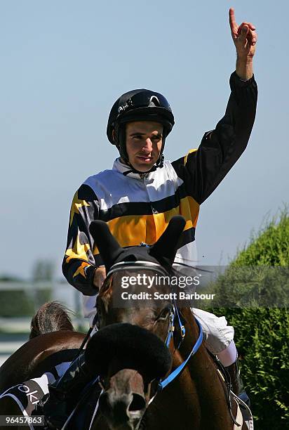 Jockey Michael Rodd gestures after riding Here De Angels to win the Rokk Ebony Rubiton Stakes during the C.F. Orr Stakes Day meeting at Caulfield...