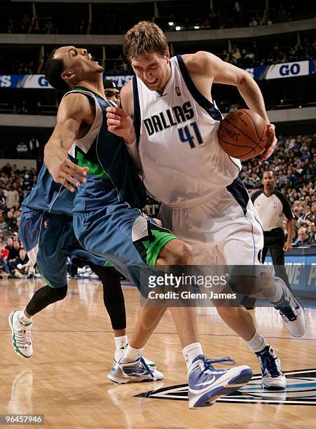 Dirk Nowitzki of the Dallas Mavericks drives against Ryan Hollins of the Minnesota Timberwolves during a game at the American Airlines Center on...