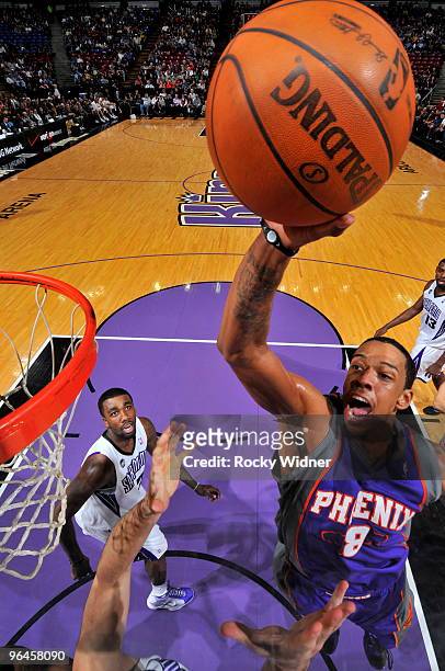 Channing Frye of the Phoenix Suns gets to the basket against Donte Greene of the Sacramento Kings on February 5, 2010 at ARCO Arena in Sacramento,...