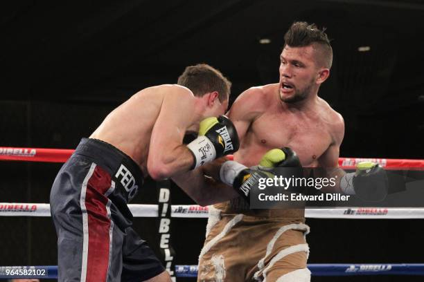 Renald Garrido lands a right hand against Serhii Fedchenko at the Hilton Westchester on April 08, 2015 in Rye Brook, New York. Fedchenko won by...