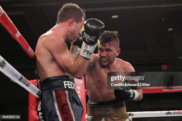 Renald Garrido lands a right hand against Serhii Fedchenko at the Hilton Westchester on April 08, 2015 in Rye Brook, New York. Fedchenko won by...