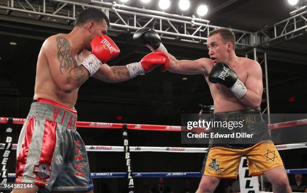 Boyd Melson trades punches with Mike Ruiz at the Hilton Westchester on April 08, 2015 in Rye Brook, New York. Melson won by unanimous decision.