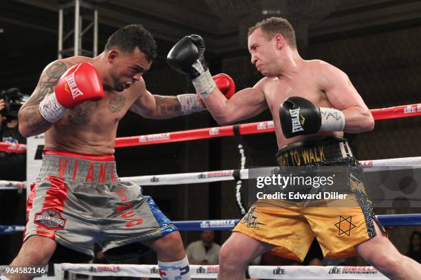 Boyd Melson trades punches with Mike Ruiz at the Hilton Westchester on April 08, 2015 in Rye Brook, New York. Melson won by unanimous decision.