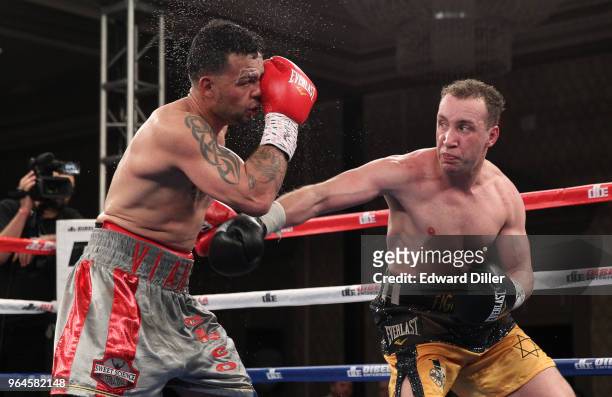 Boyd Melson lands a right hand against Mike Ruiz at the Hilton Westchester on April 08, 2015 in Rye Brook, New York. Melson won by unanimous decision.
