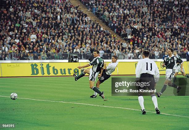 Michael Owen of England shoots to score England's equalising goal during the FIFA 2002 World Cup Qualifier against Germany played at the Olympic...