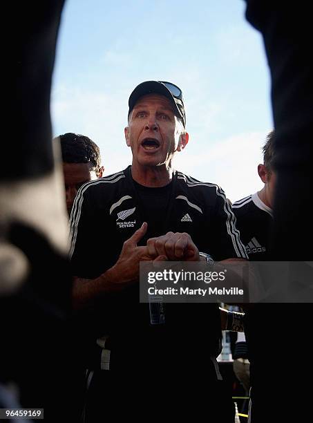 Gordon Tietjens head coach of New Zealand talks to his team after the Semi Final Cup match between New Zealand and Samoa during day two of the...