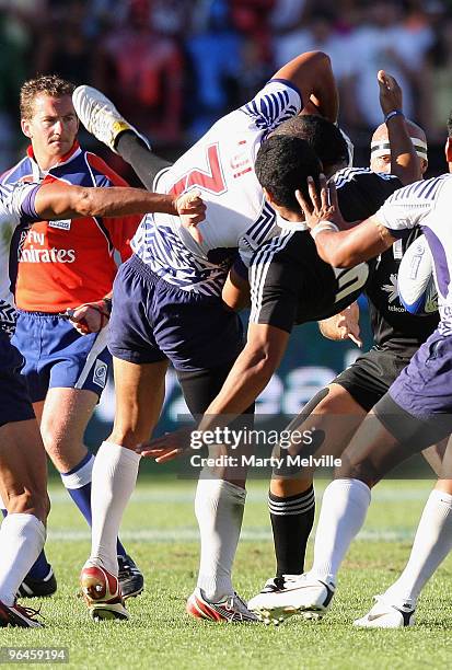 Fritz Lee of New Zealand is spear tackled by Lolo Lui of Samoa in the Semi Final Cup match between New Zealand and Samoa during day two of the...