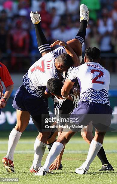 Fritz Lee of New Zealand is spear tackled by Lolo Lui of Samoa in the Semi Final Cup match between New Zealand and Samoa during day two of the...